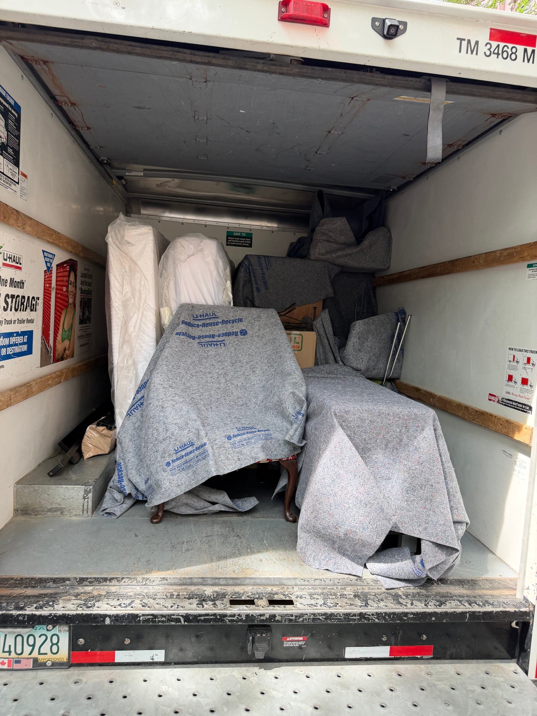 Protected furniture loaded inside a moving truck