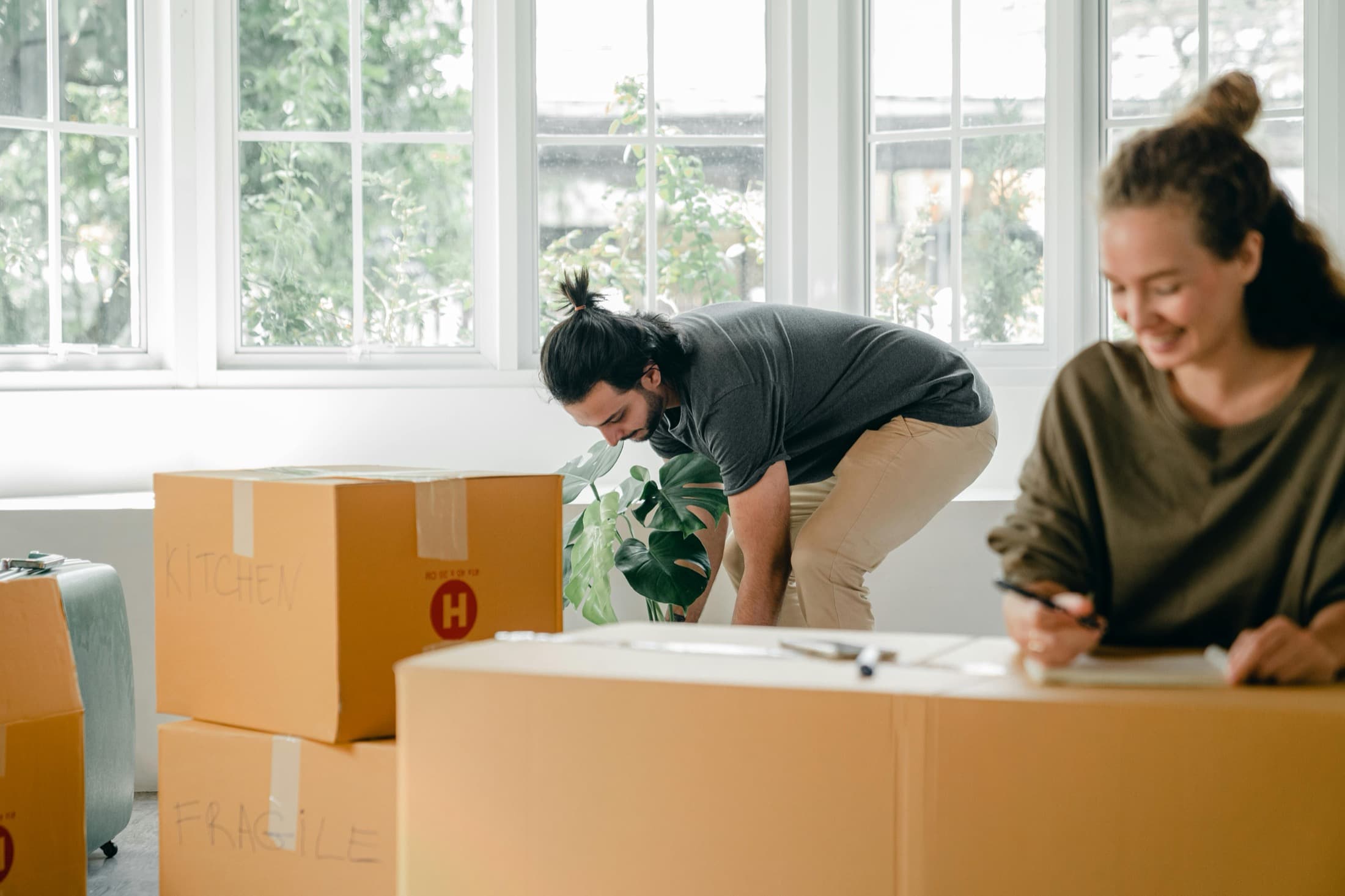 Move-in boxes being organized near a window