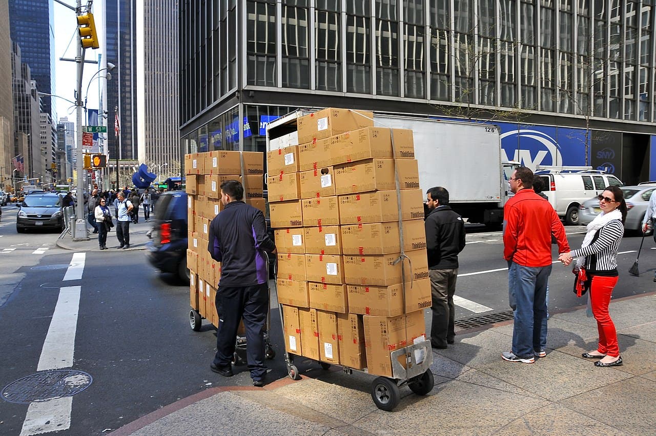Moving boxes staged beside a truck in NYC
