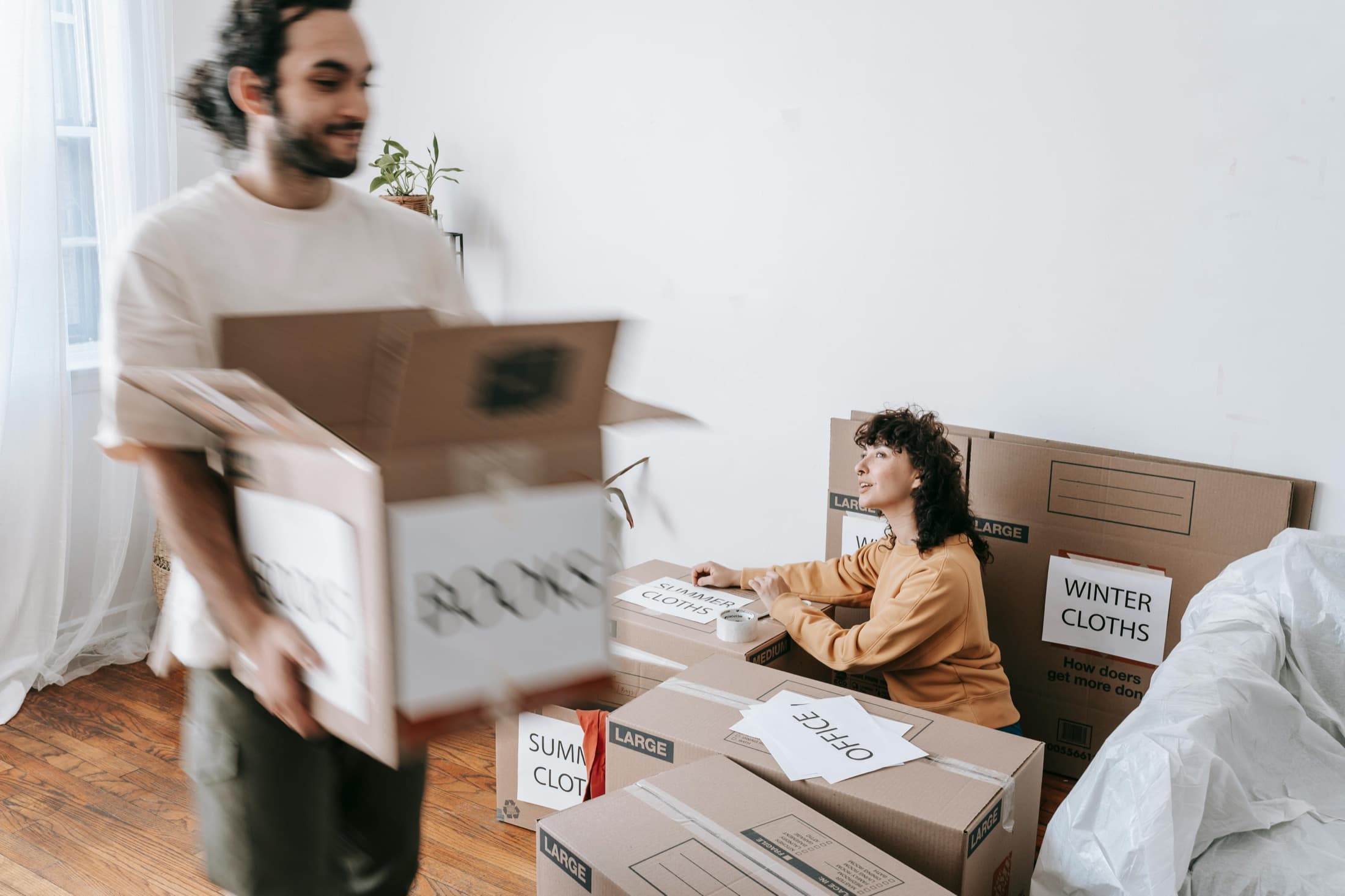 Moving boxes sorted by room